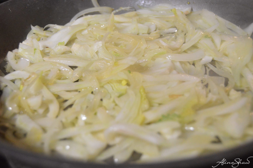 sliced fennel and onions in a skillet