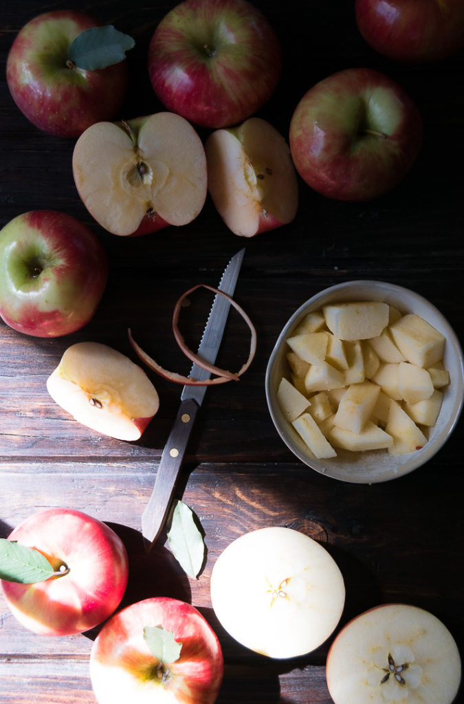 Sliced apples on a wooden cutting board