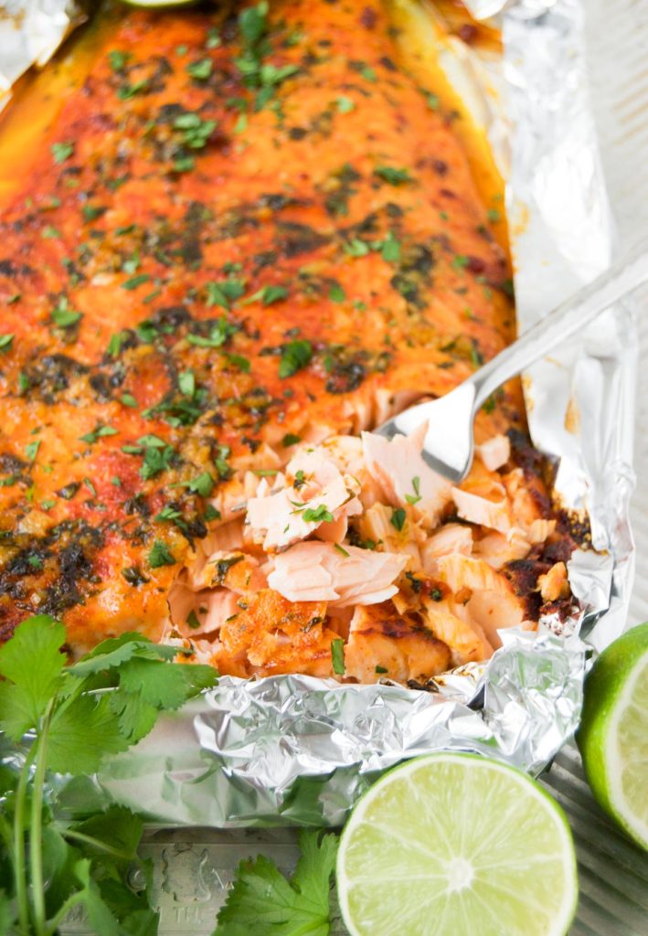 Baked Lime Salmon served with cilantro and limes