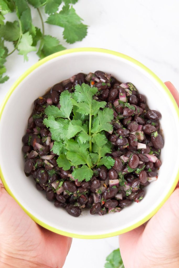 A bowl of black bean salsa with cilantro