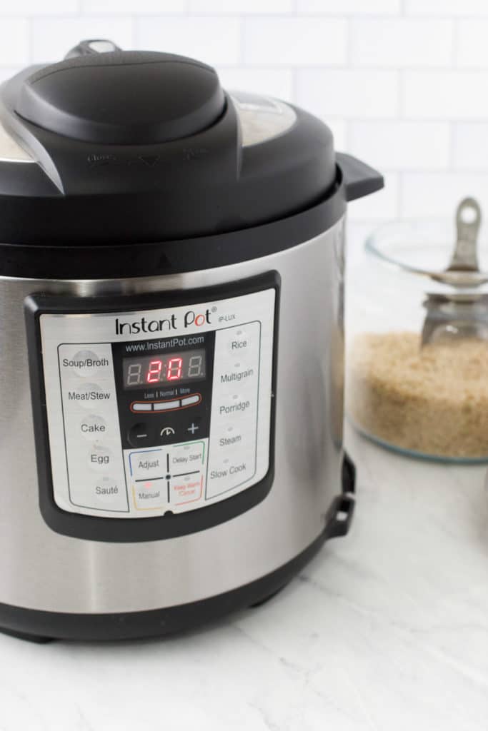 the instant pot cooks on a marble countertop