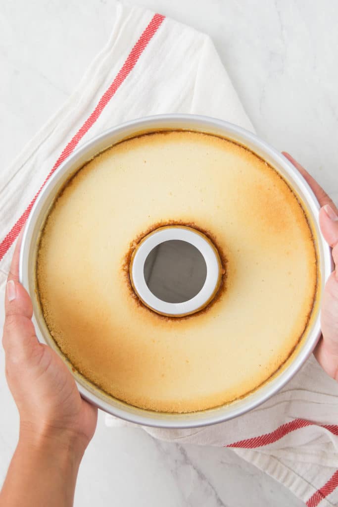 A Brazilian Flan after baking on top of a red and white striped towel