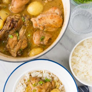 A bowl of Brazilian Chicken Stew next to a pot of it