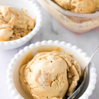 close up of a bowl of dulce de leche ice cream on marble