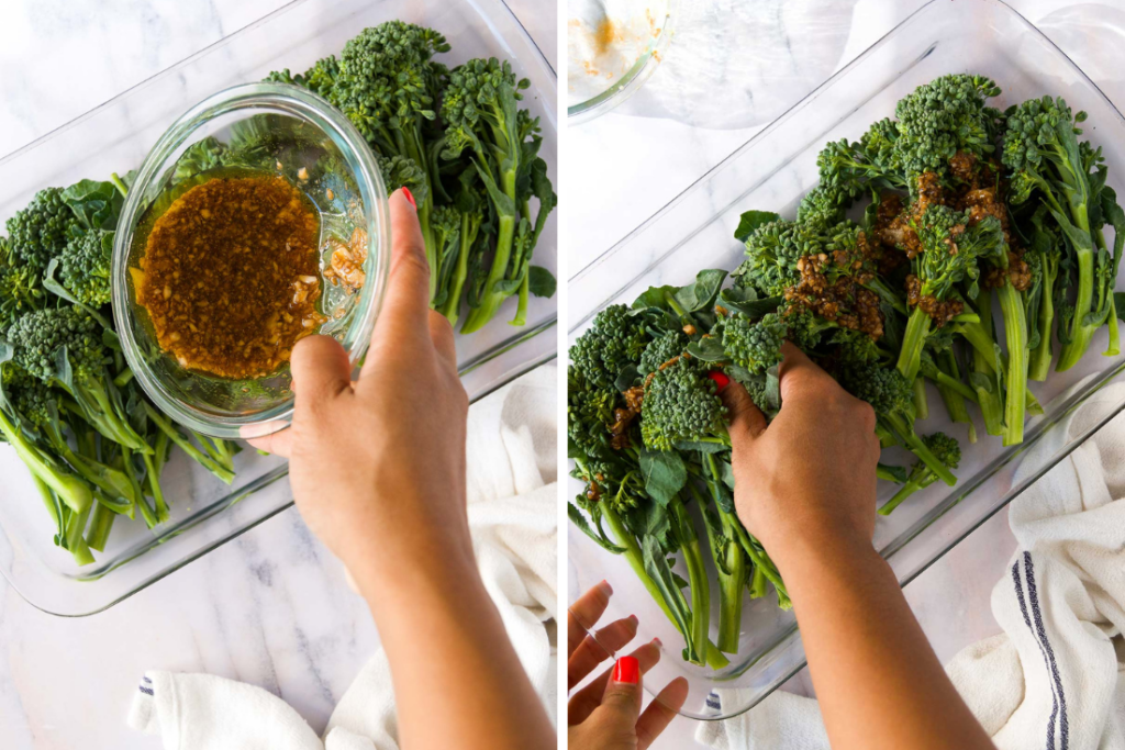 collage showing two images of a seasoning blend being poured on top of a broccolini on a platter and a hand massaging the ingredients into the broccolini